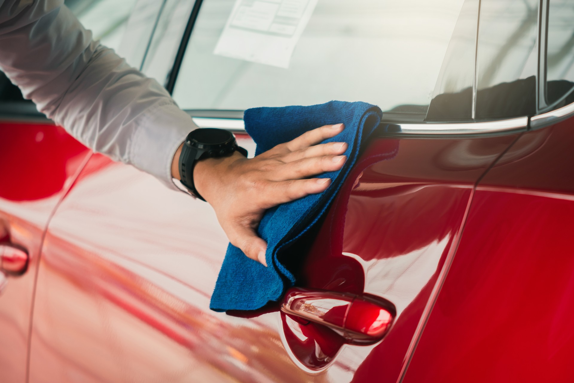 Man asian inspection and cleaning Equipment car wash With red car For cleaning to quality to customer on car showroom of service transport automobile transportation automotive image.